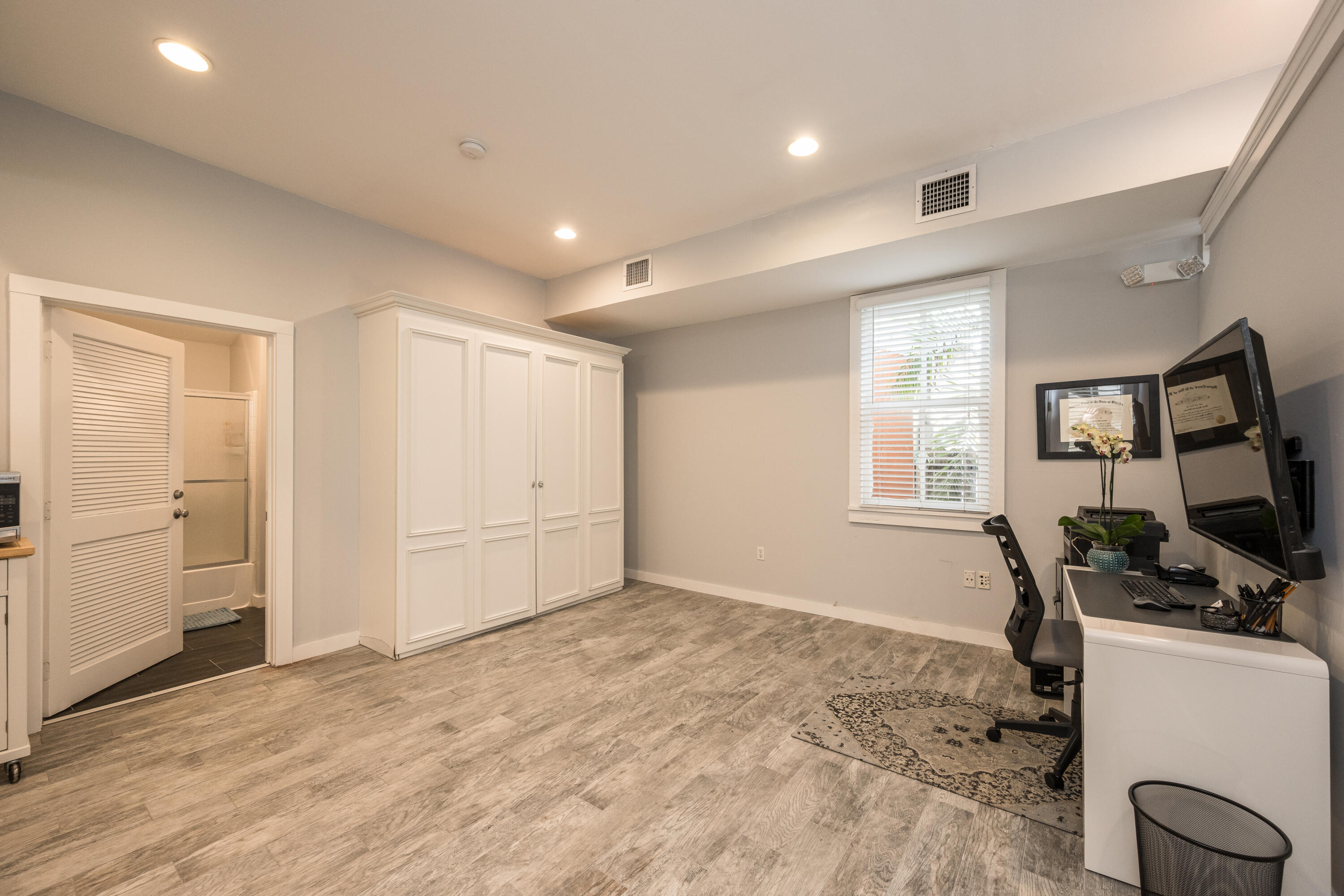 405 Petronia Street Key West, FL 33040 - Photo 31 of 47 a view of a workspace with furniture and a window