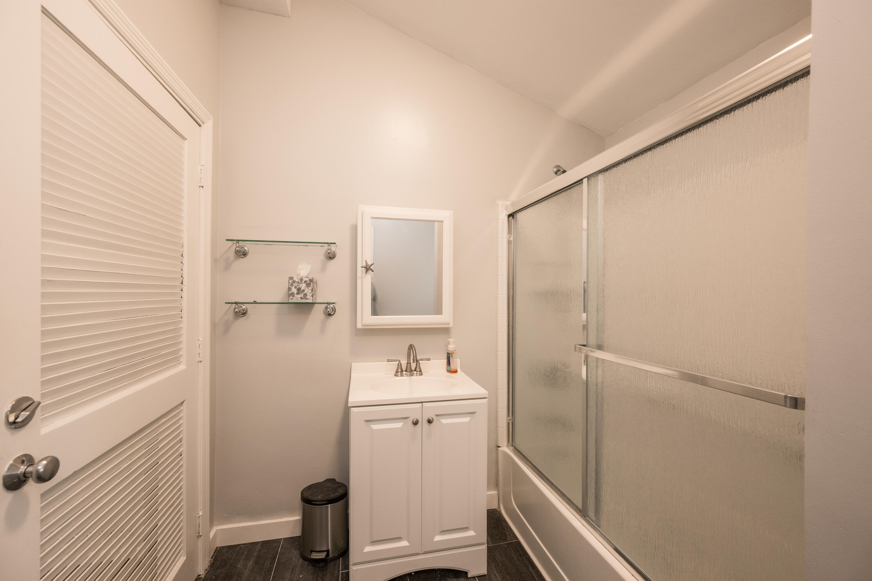 405 Petronia Street Key West, FL 33040 - Photo 38 of 47 a bathroom with a sink a toilet and shower