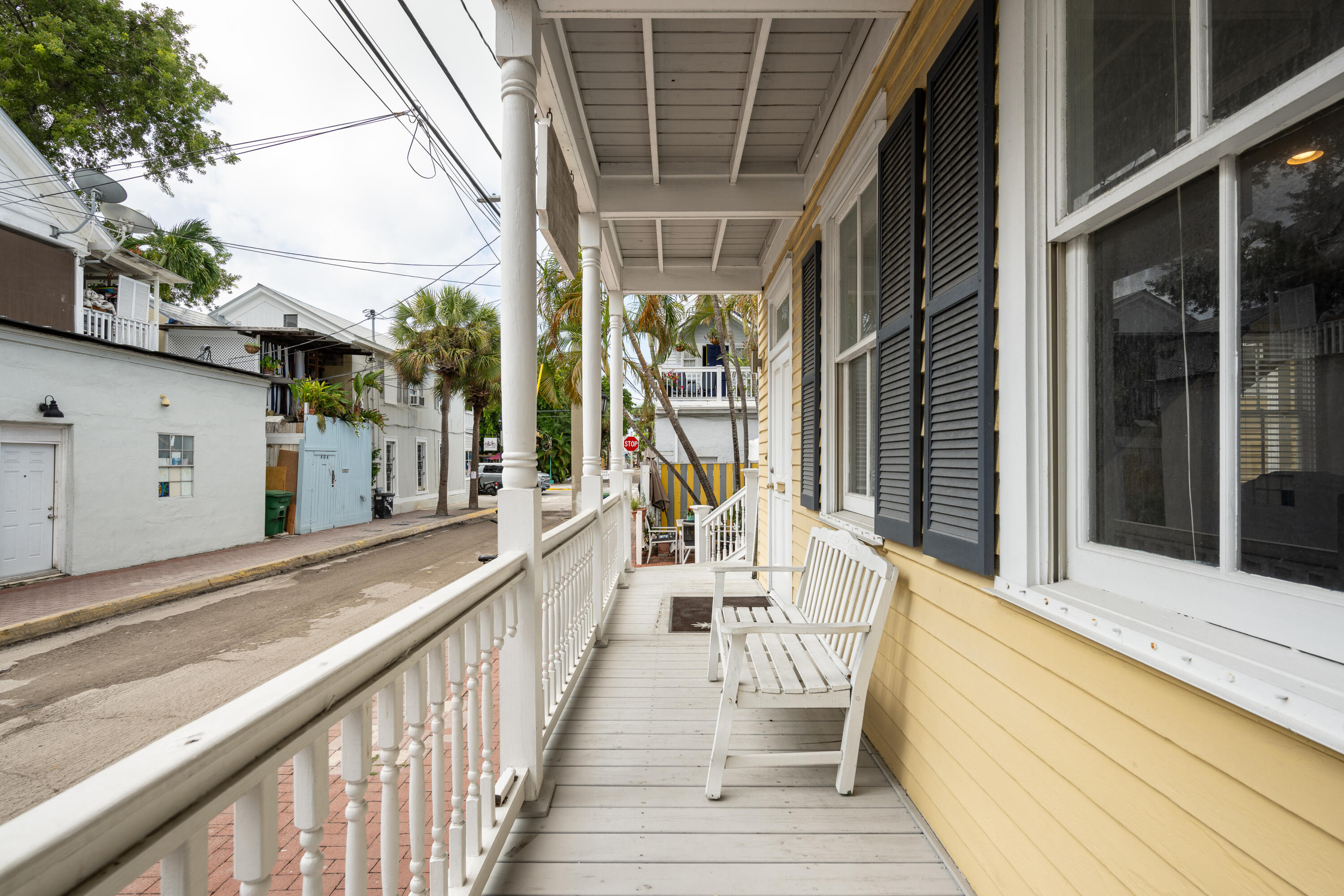 405 Petronia Street Key West, FL 33040 - Photo 5 of 47 a view of a balcony with wooden floor and stairs