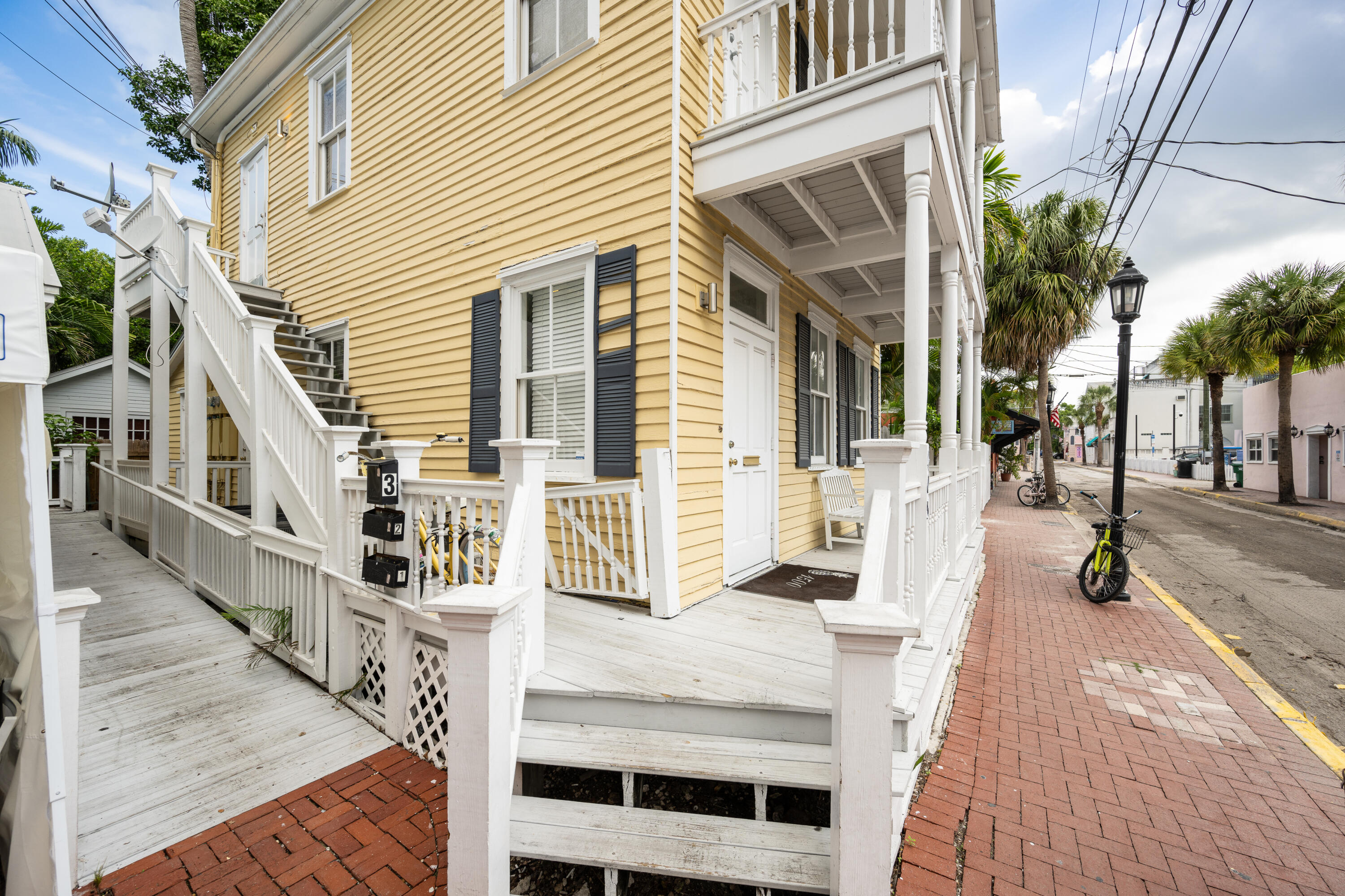 405 Petronia Street Key West, FL 33040 - Photo 6 of 47 front view of a house with a patio