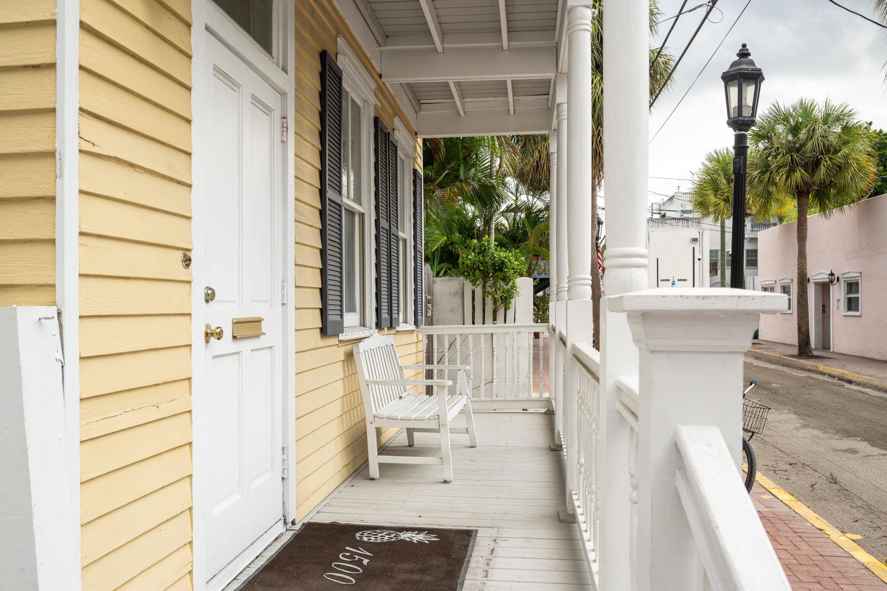 405 Petronia Street Key West, FL 33040 - Photo 7 of 47 a view of a balcony with wooden floor and outdoor space