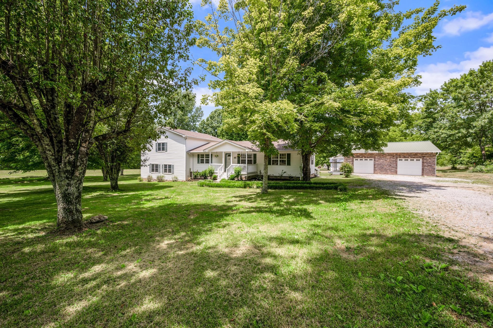 5799 Cane Ridge Road Antioch, TN 37013 - Photo 3 of 45 a front view of a house with a yard