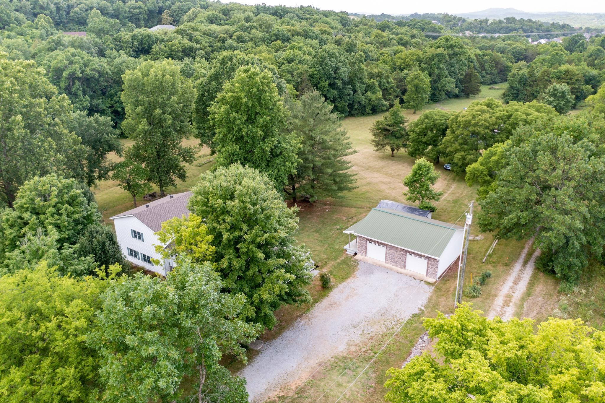 5799 Cane Ridge Road Antioch, TN 37013 - Photo 31 of 45 an aerial view of a house with a yard and lake view