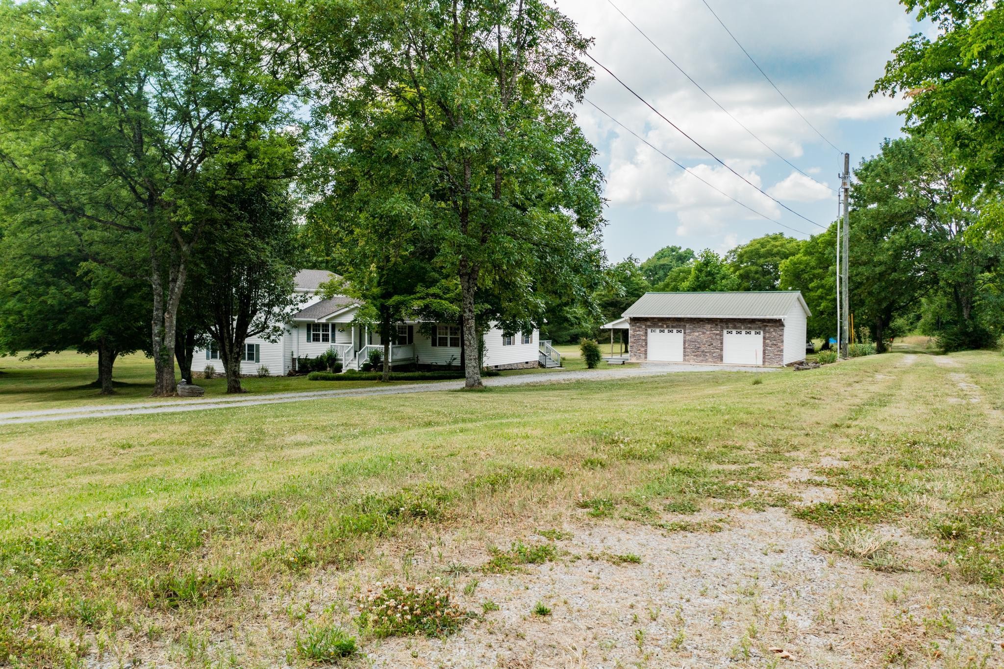 5799 Cane Ridge Road Antioch, TN 37013 - Photo 32 of 45 a front view of a house with a yard and trees