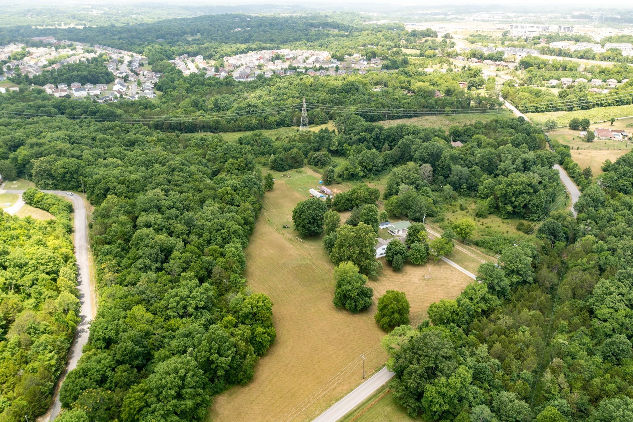 5799 Cane Ridge Road Antioch, TN 37013 - Photo 38 of 45 an aerial view of residential houses with outdoor space and trees