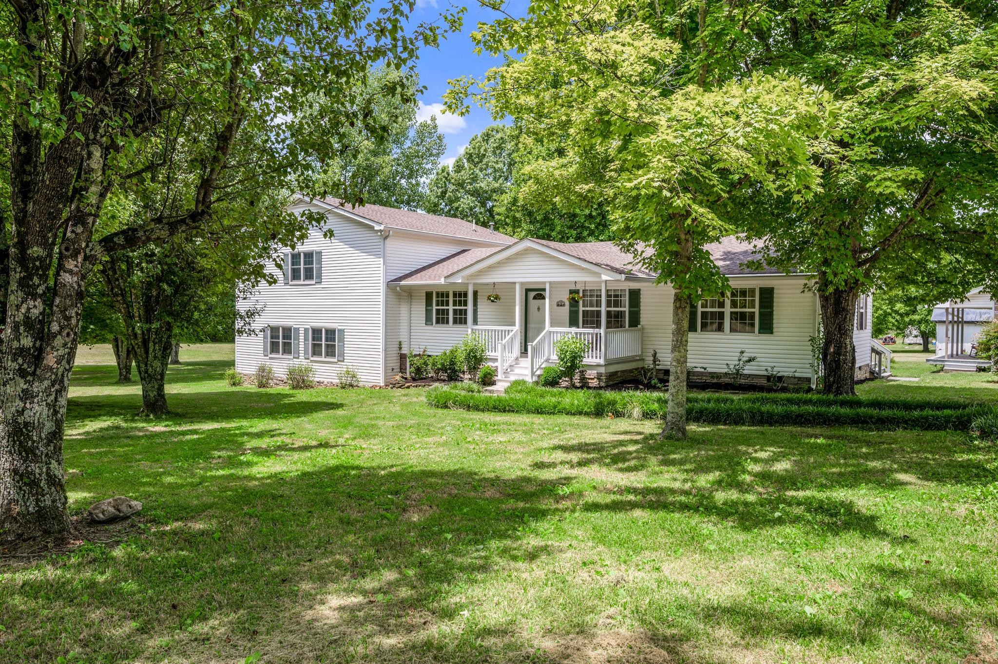 5799 Cane Ridge Road Antioch, TN 37013 - Photo 4 of 45 a view of a house with a big yard and large trees