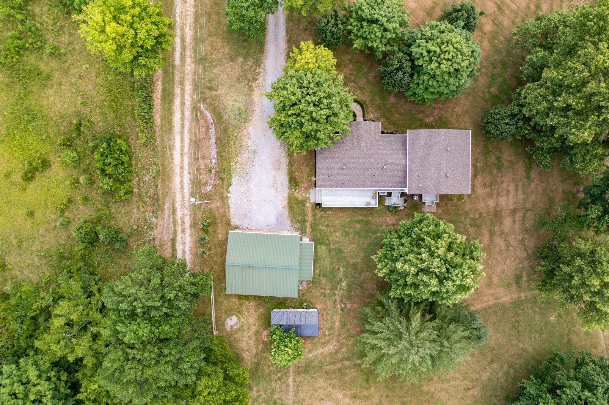 5799 Cane Ridge Road Antioch, TN 37013 - Photo 43 of 45 an aerial view of a house with garden space and trees all around