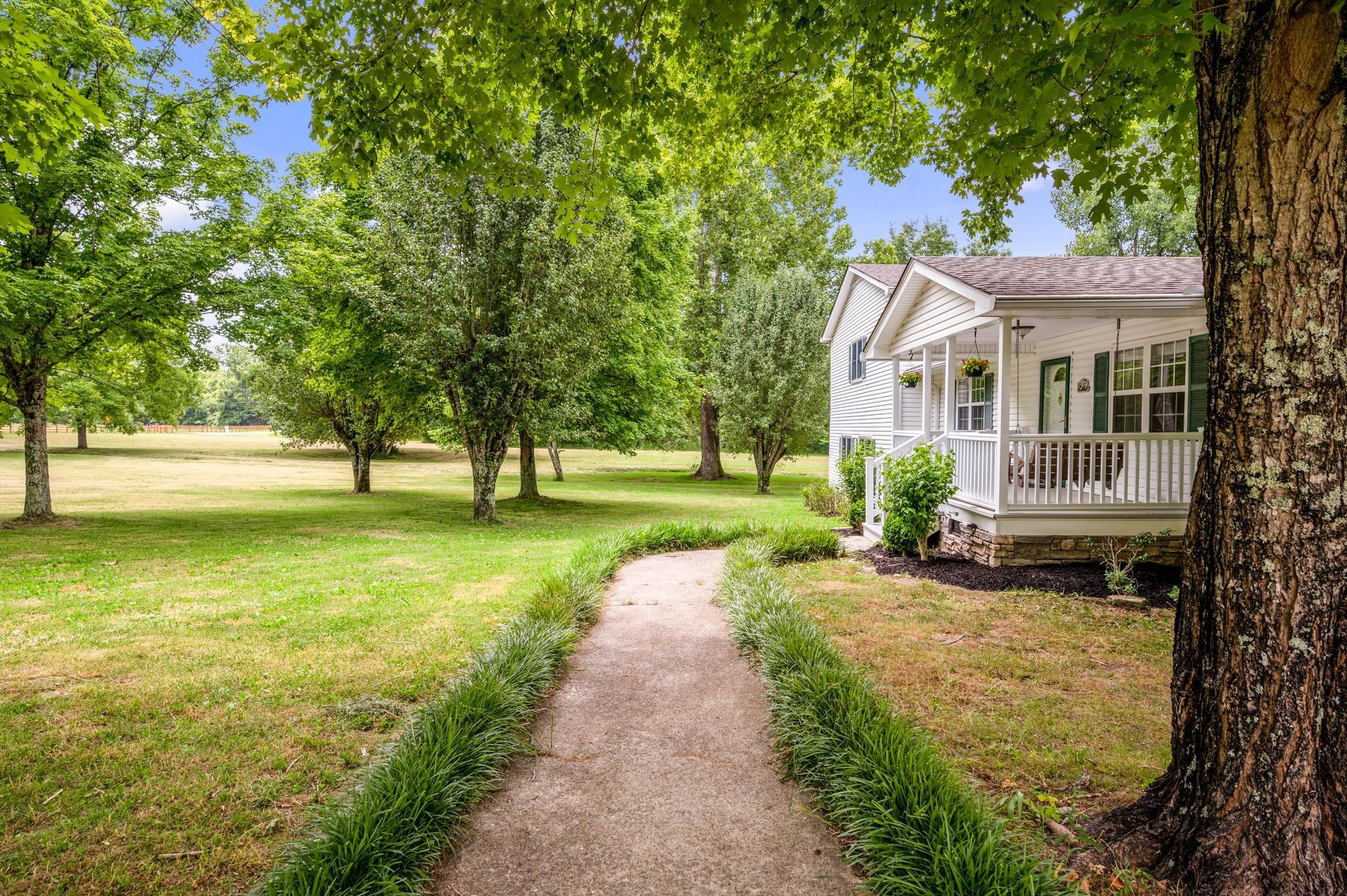 5799 Cane Ridge Road Antioch, TN 37013 - Photo 5 of 45 a view of a house with a garden