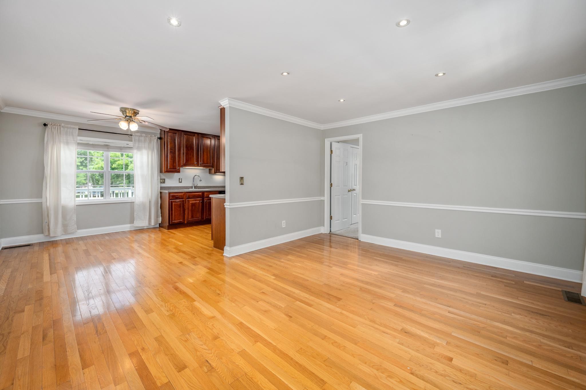 5799 Cane Ridge Road Antioch, TN 37013 - Photo 7 of 45 a view of empty room with wooden floor and fan
