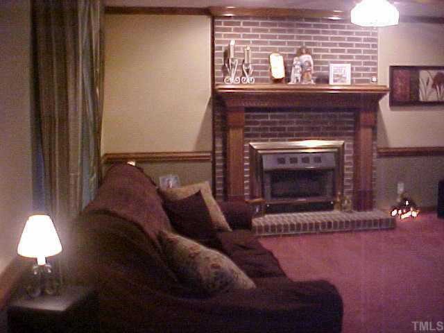 10 Turnipseed Road Wendell, NC 27591 - Photo 12 of 12 Nice family room with brick wood burning fireplace