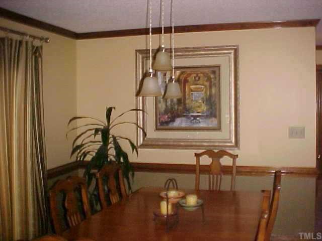 10 Turnipseed Road Wendell, NC 27591 - Photo 3 of 12 Dining area adjoins kitchen and overlooks deck with hot tub.