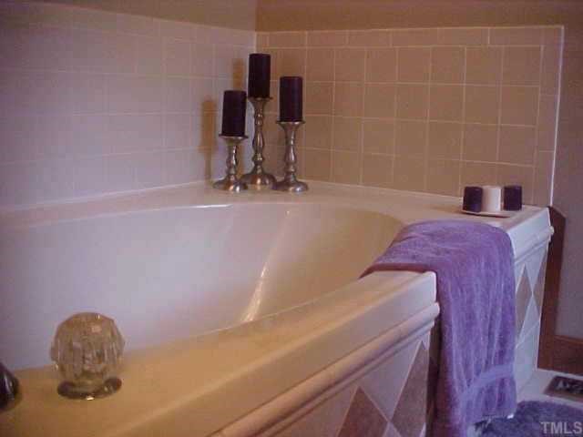 10 Turnipseed Road Wendell, NC 27591 - Photo 7 of 12 Master bath has garden tub, sep shower, dual vanity, and WIC closet