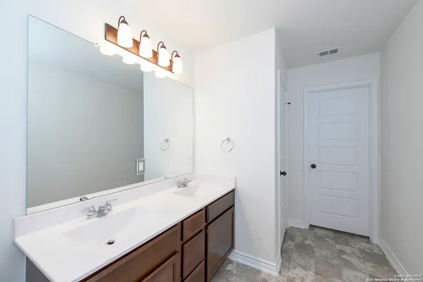 a view of a room with shelf on the wall
