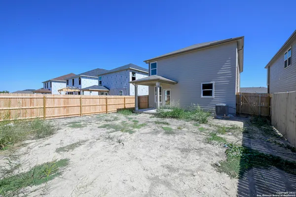 a house view with a backyard space
