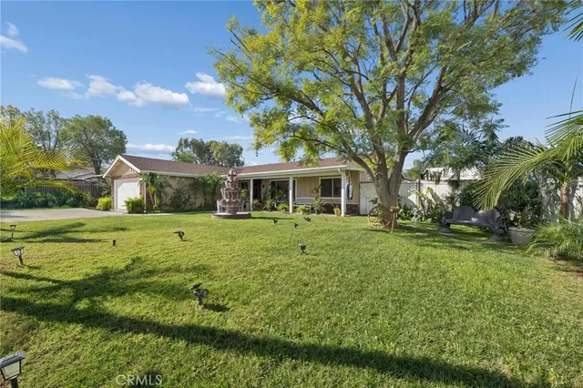 a kitchen with stainless steel appliances a stove a sink and a refrigerator