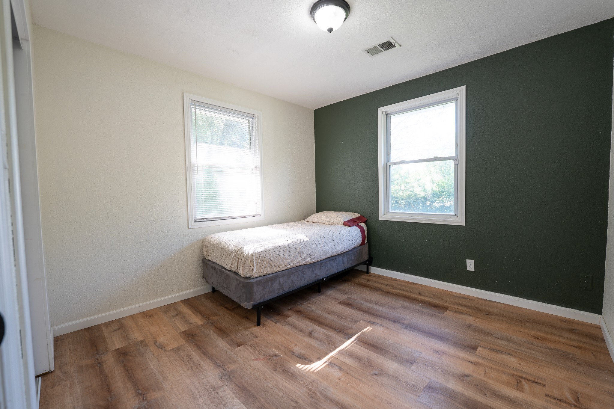 8247 Pinewood Road Nunnelly, TN 37137 - Photo 9 of 14 a bedroom with a bed and a window