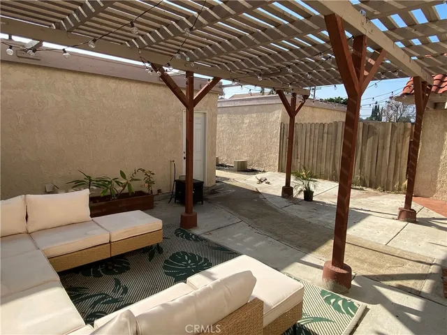 a outdoor space with patio lots of furniture and glass door