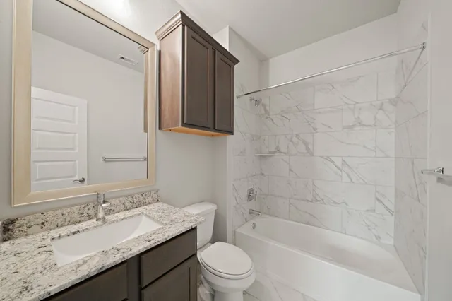 an empty room with a ceiling fan and a window