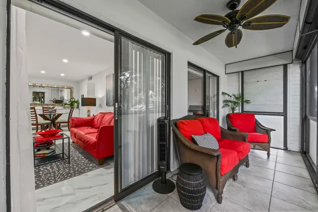 a living room with furniture a rug and a fireplace