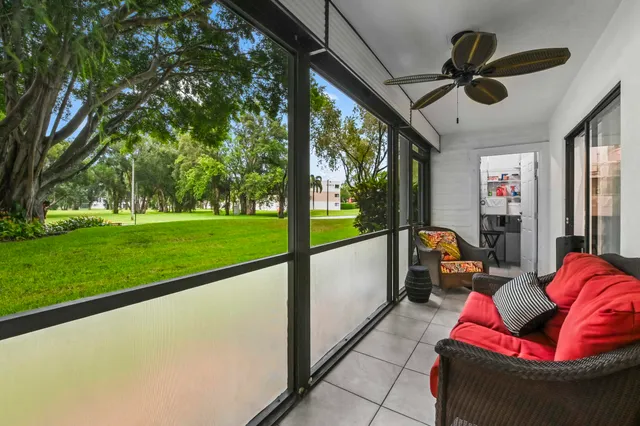 a view of swimming pool with seating space