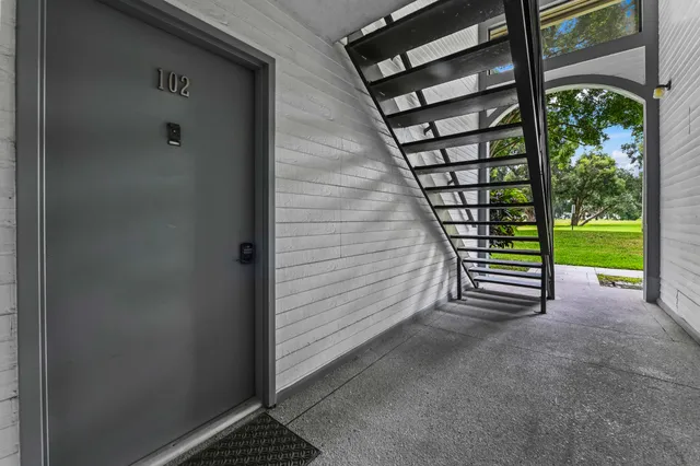 a view of a porch with wooden floor and a porch