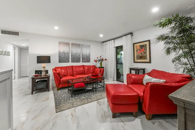 a living room with furniture and a couch