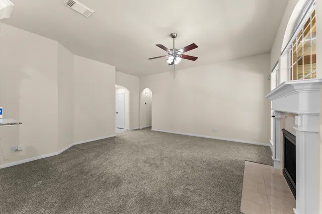 a kitchen with granite countertop a sink stove and cabinets