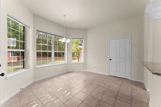 a hallway with a sink and cabinets