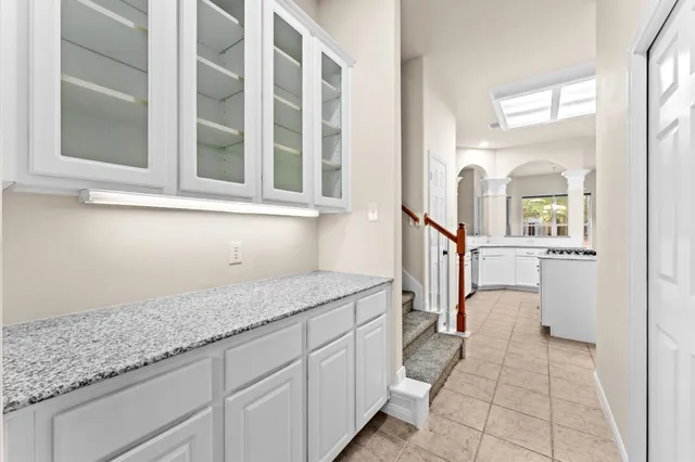 a view of a storage & utility room with racks on the wall