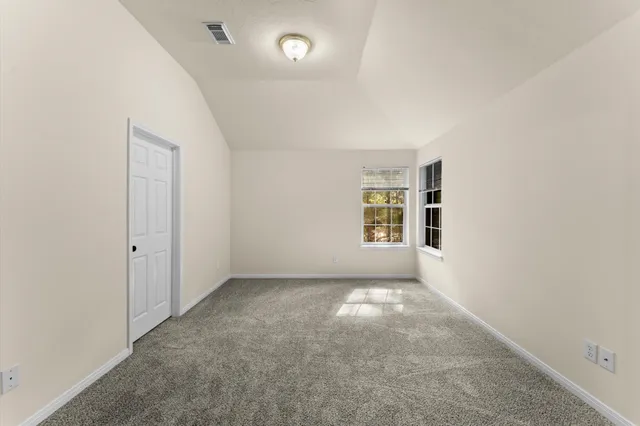 a view of a house with wooden deck
