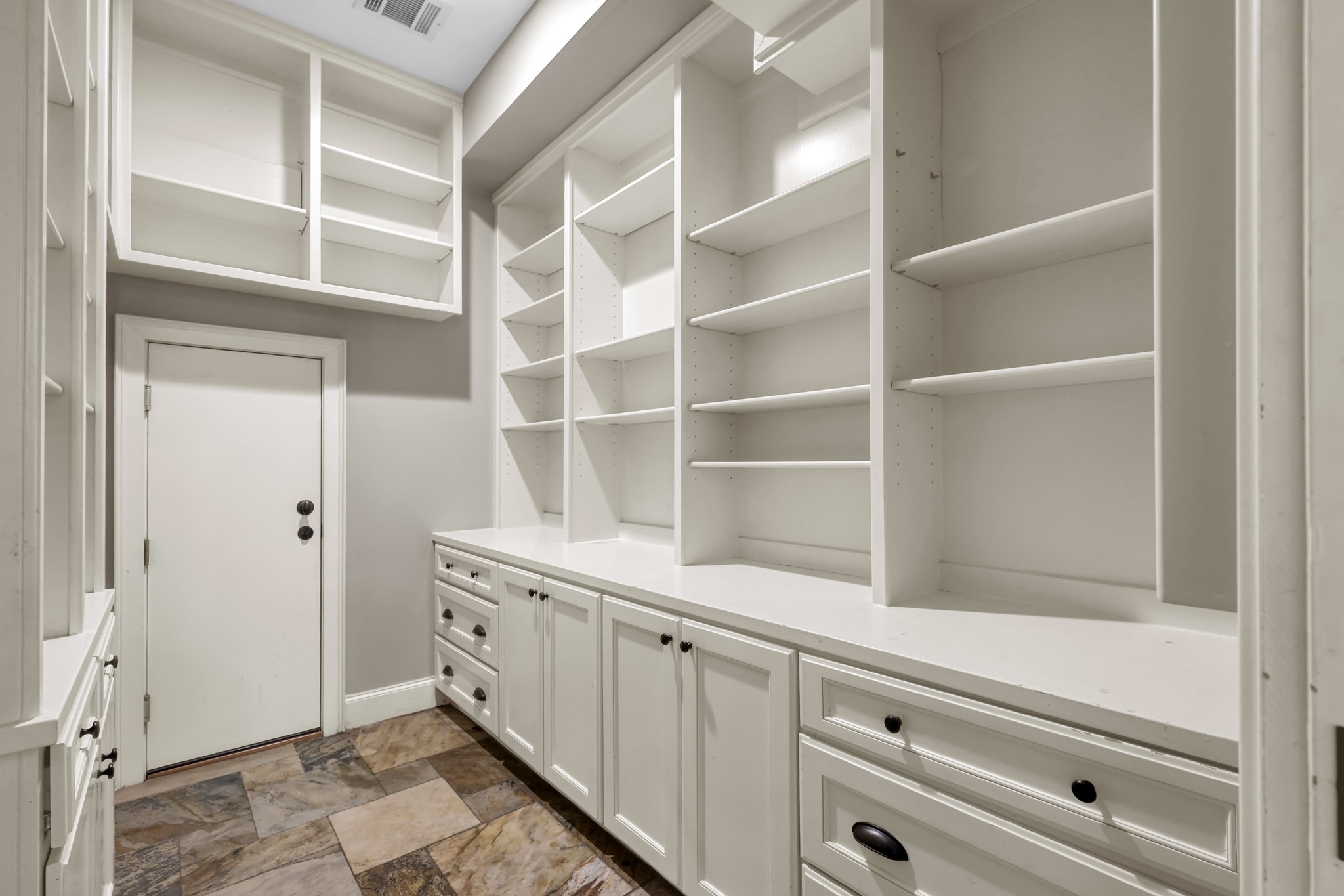 9602 Chatfield Street Houston, TX 77025 - Photo 11 of 48 a hallway with cabinets