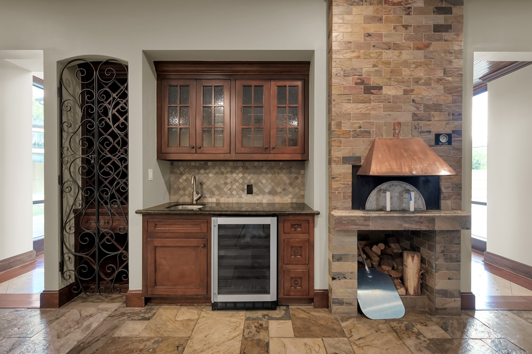 9602 Chatfield Street Houston, TX 77025 - Photo 14 of 48 a kitchen with granite countertop a stove top oven and cabinets