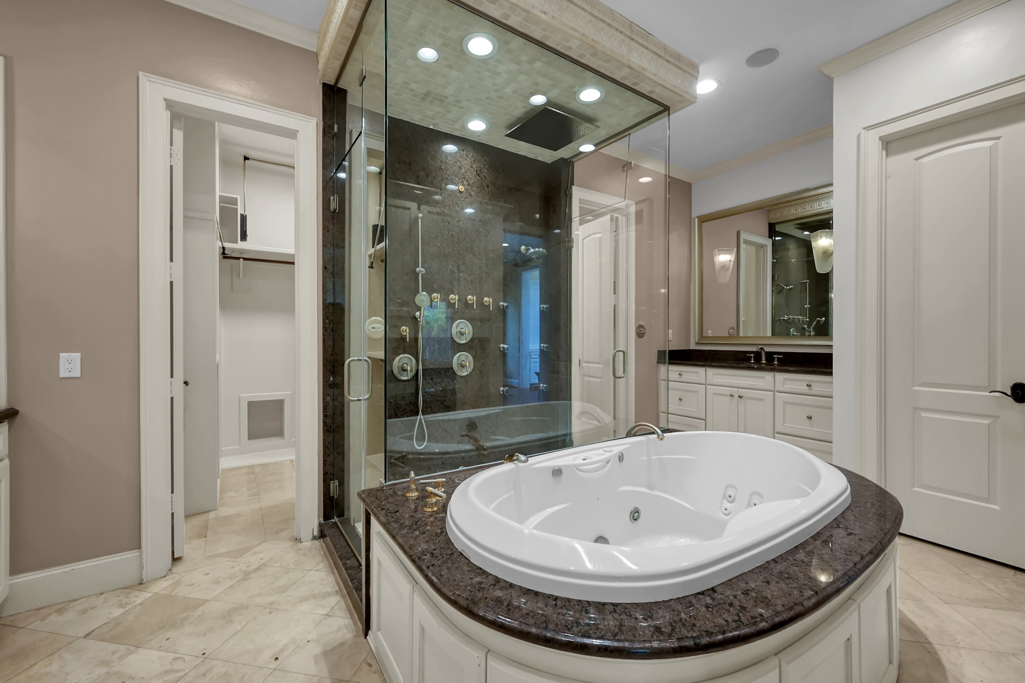 9602 Chatfield Street Houston, TX 77025 - Photo 22 of 48 a view of a bathroom with a sink and a mirror