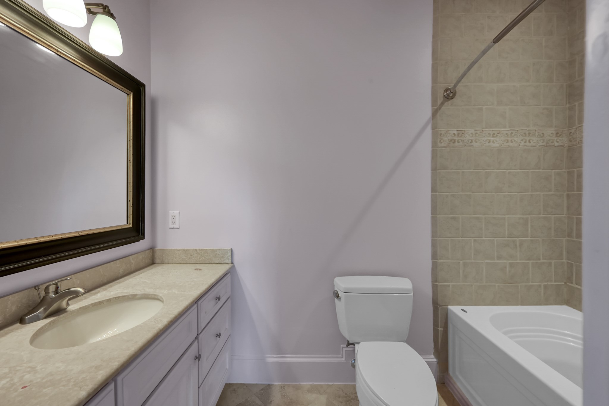 9602 Chatfield Street Houston, TX 77025 - Photo 31 of 48 a bathroom with a granite countertop toilet a sink and a mirror