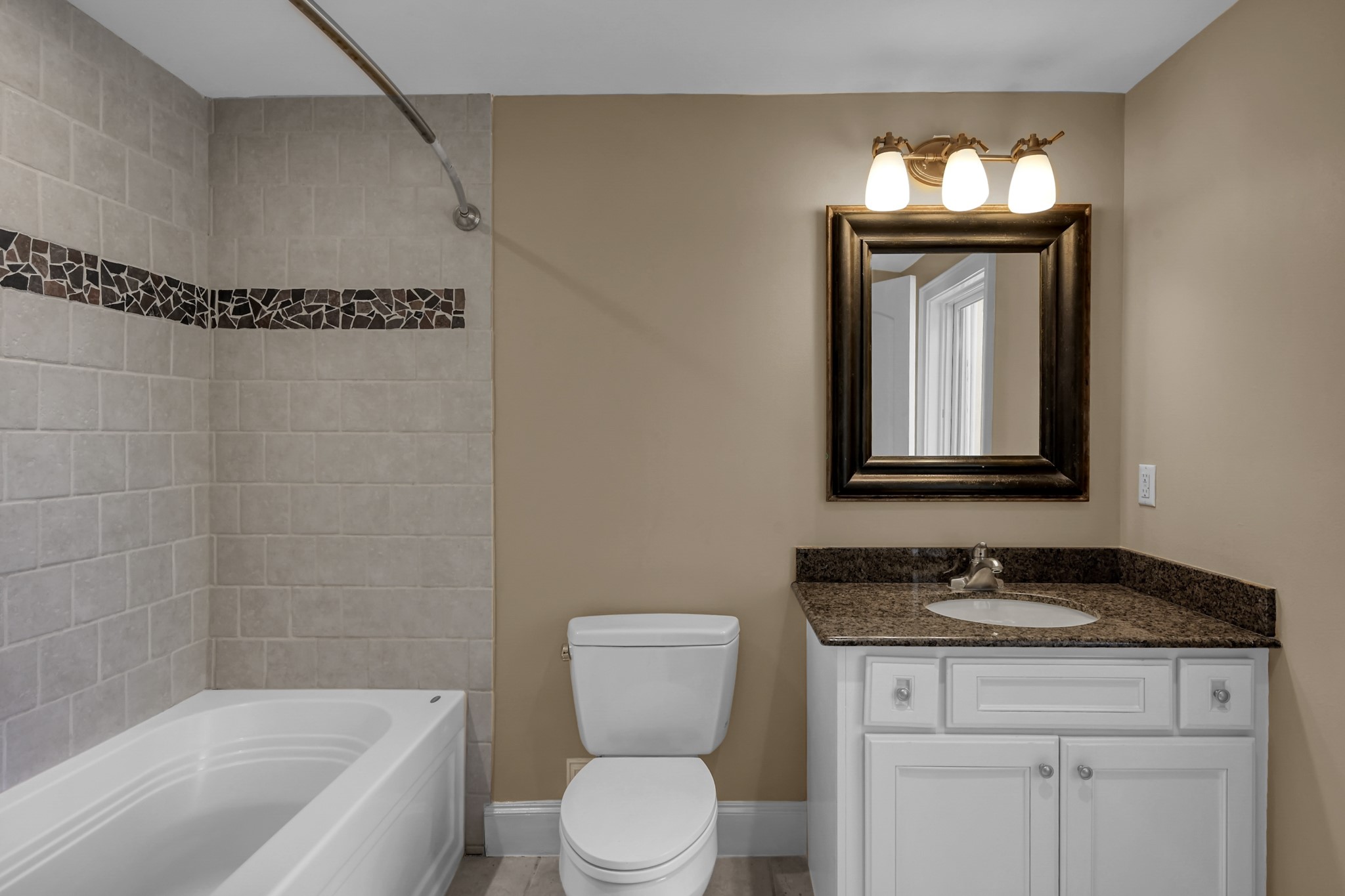 9602 Chatfield Street Houston, TX 77025 - Photo 33 of 48 a bathroom with a granite countertop sink a toilet and bathtub