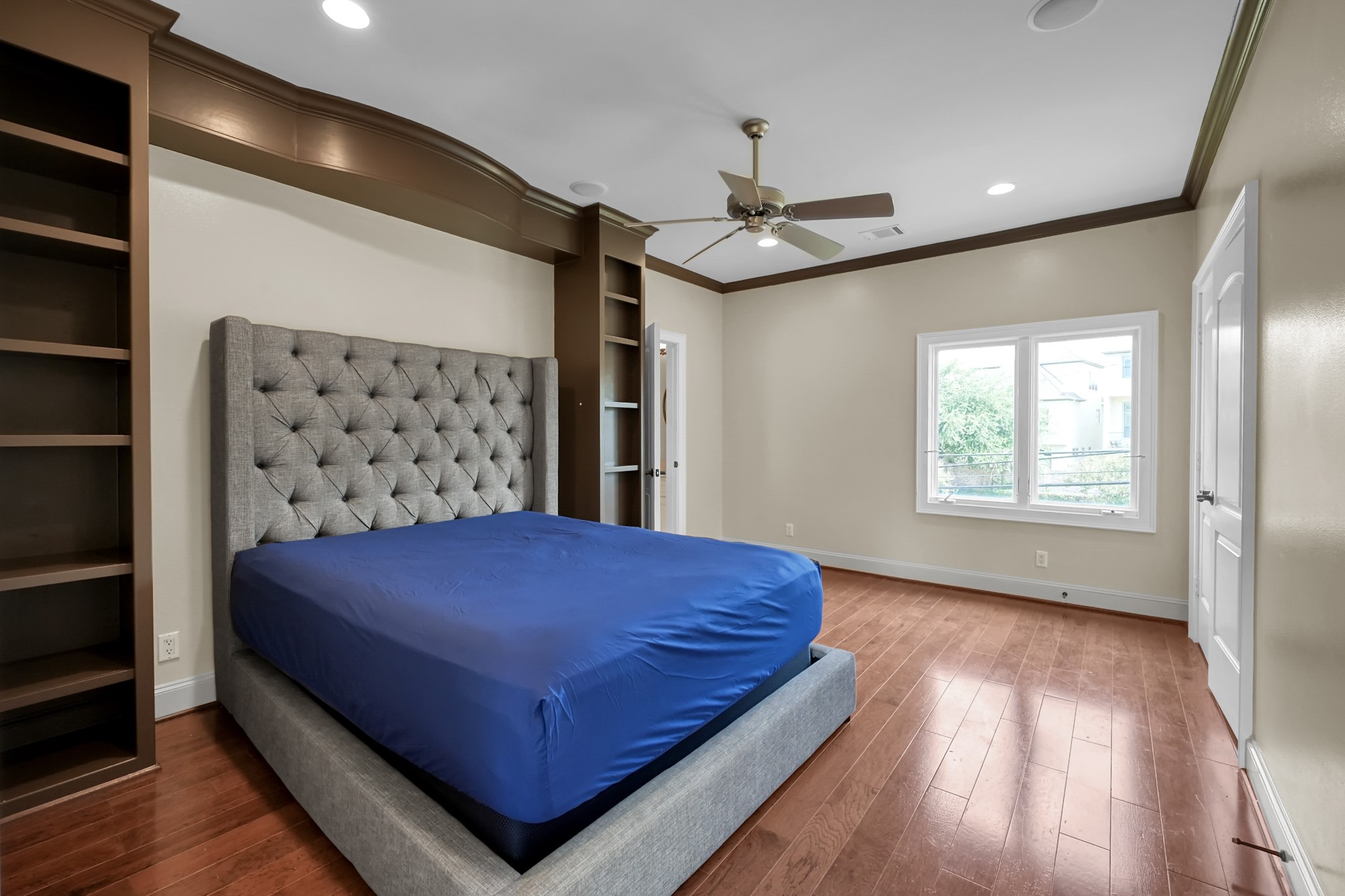 9602 Chatfield Street Houston, TX 77025 - Photo 36 of 48 a bedroom with a large bed and a window