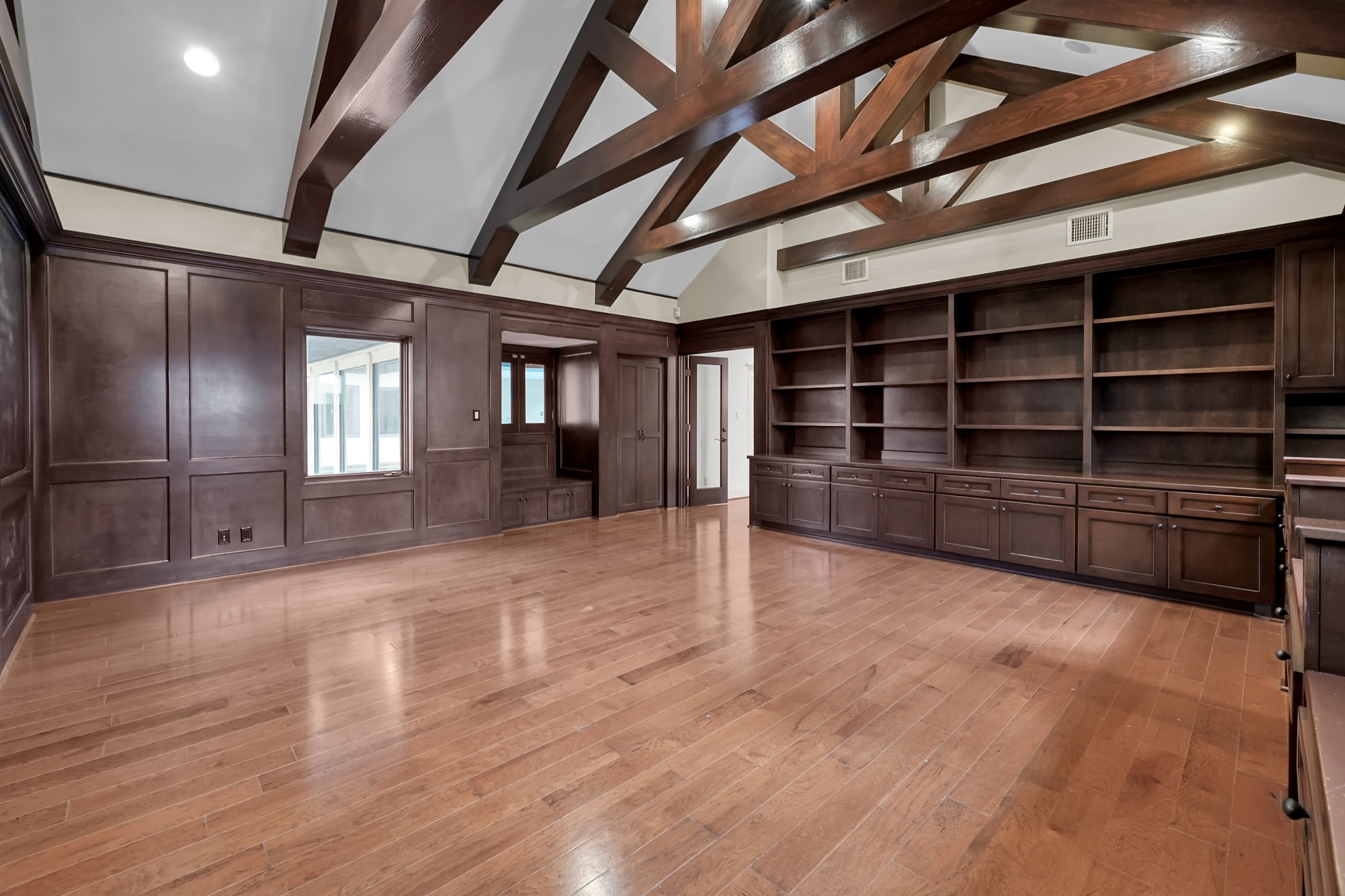 9602 Chatfield Street Houston, TX 77025 - Photo 40 of 48 a view of an empty room with wooden floor and a window