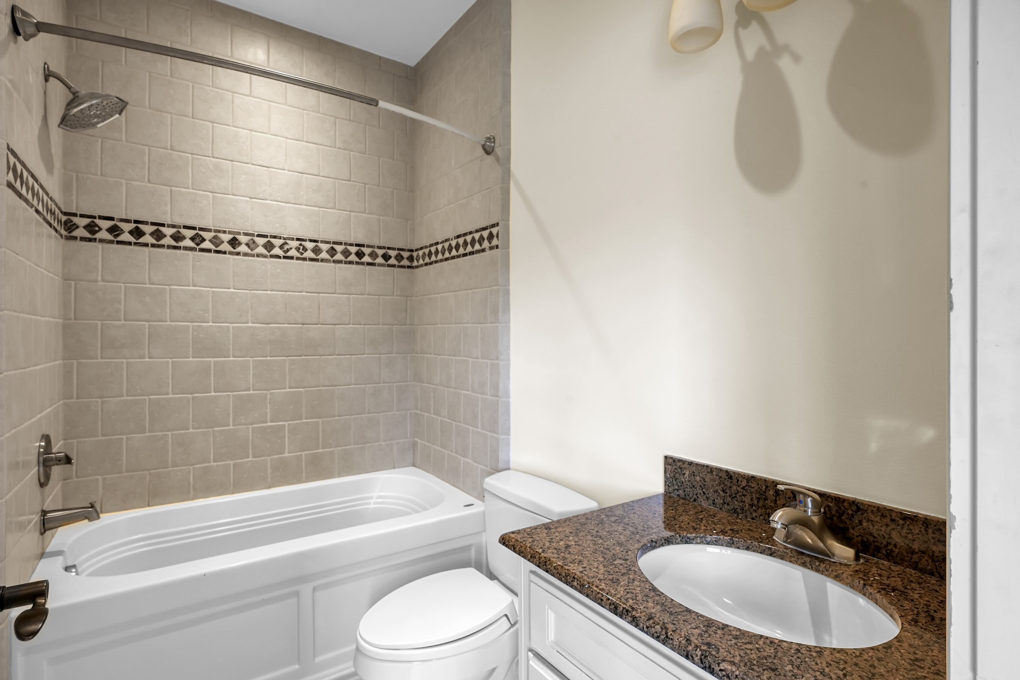 9602 Chatfield Street Houston, TX 77025 - Photo 41 of 48 a bathroom with a granite countertop bathtub shower sink vanity and toilet