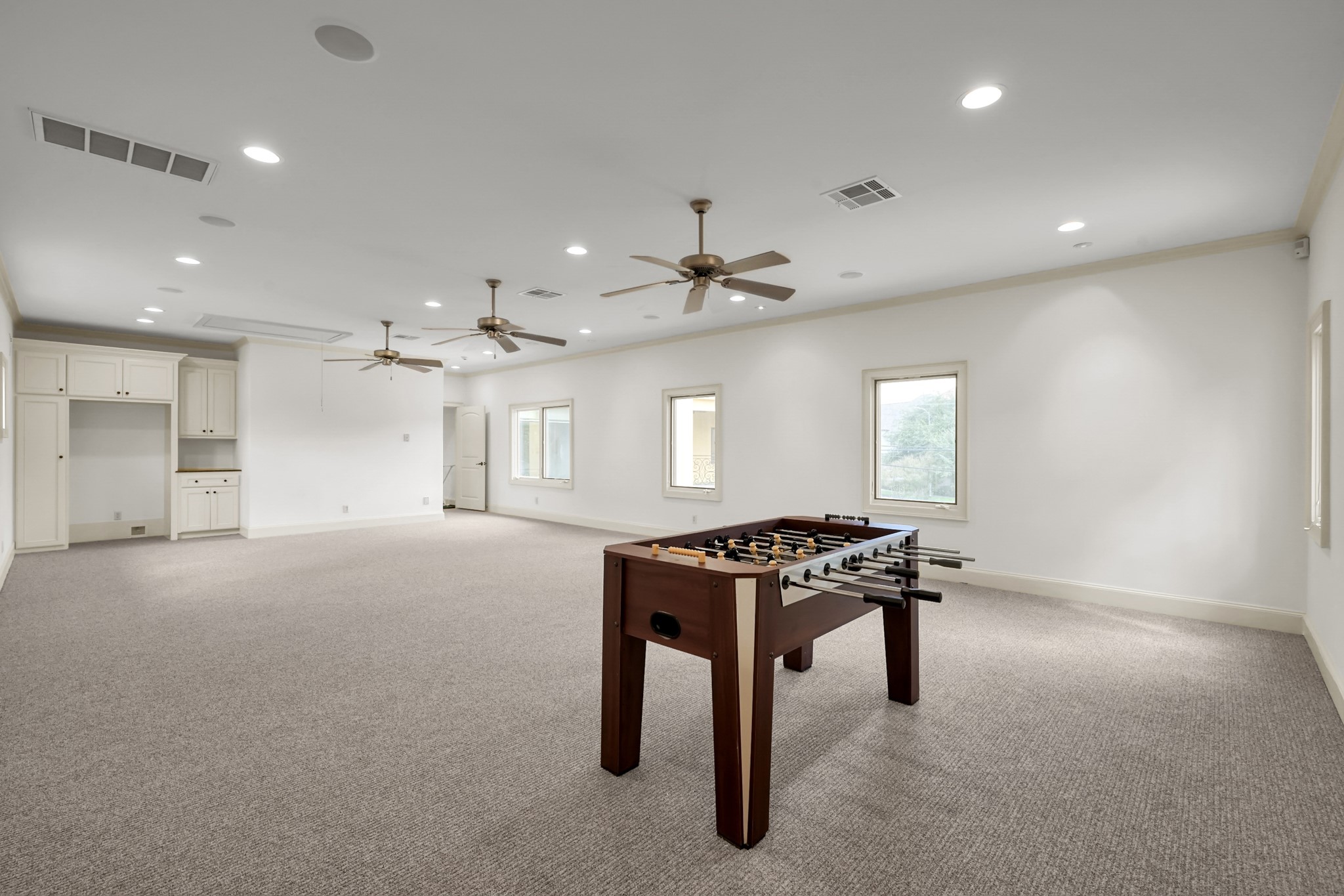 9602 Chatfield Street Houston, TX 77025 - Photo 42 of 48 a kitchen that has a lot of cabinets in it