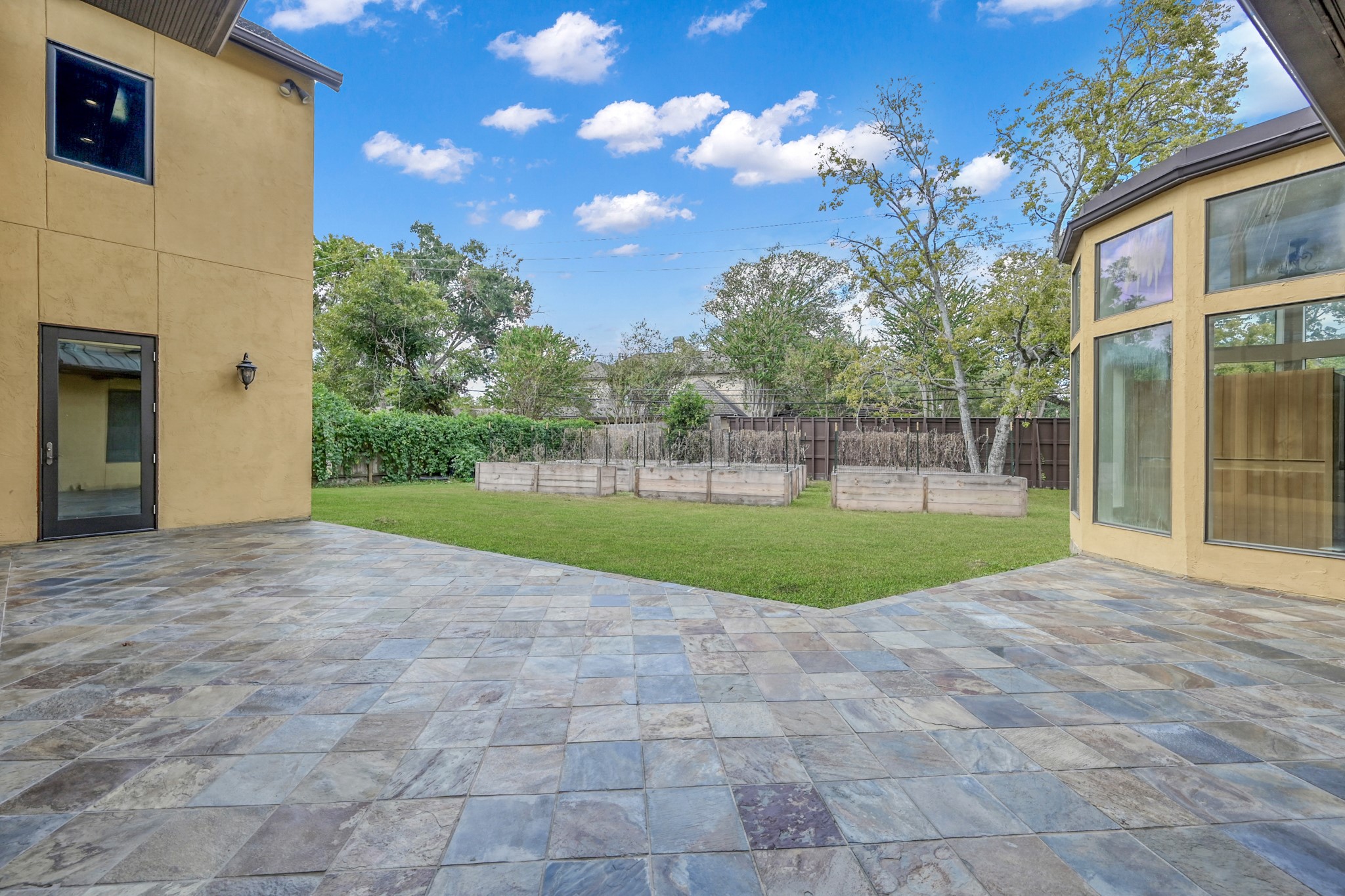 9602 Chatfield Street Houston, TX 77025 - Photo 44 of 48 a view of a house with a big yard and large tree