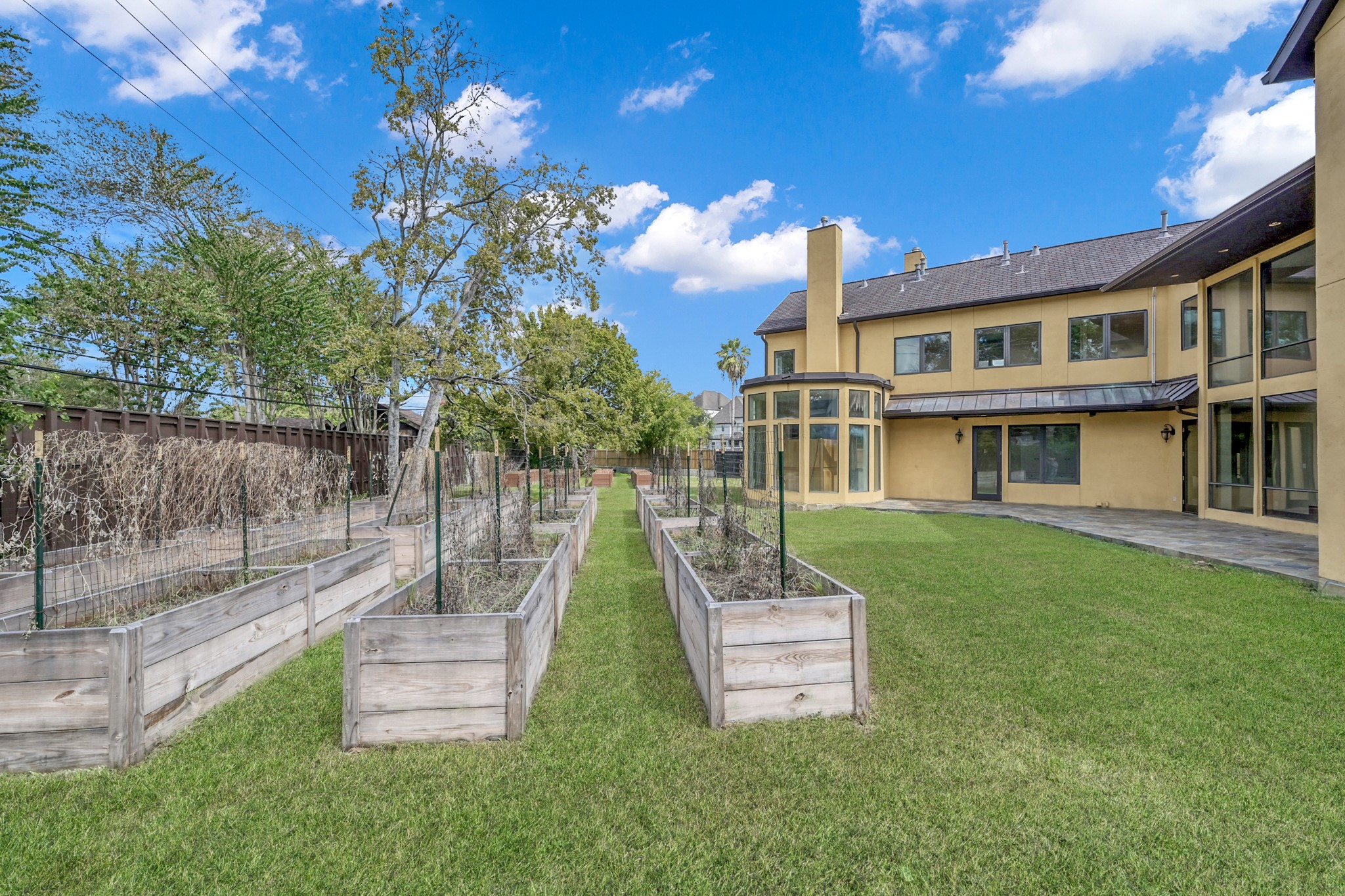 9602 Chatfield Street Houston, TX 77025 - Photo 46 of 48 a front view of a house with a garden and yard