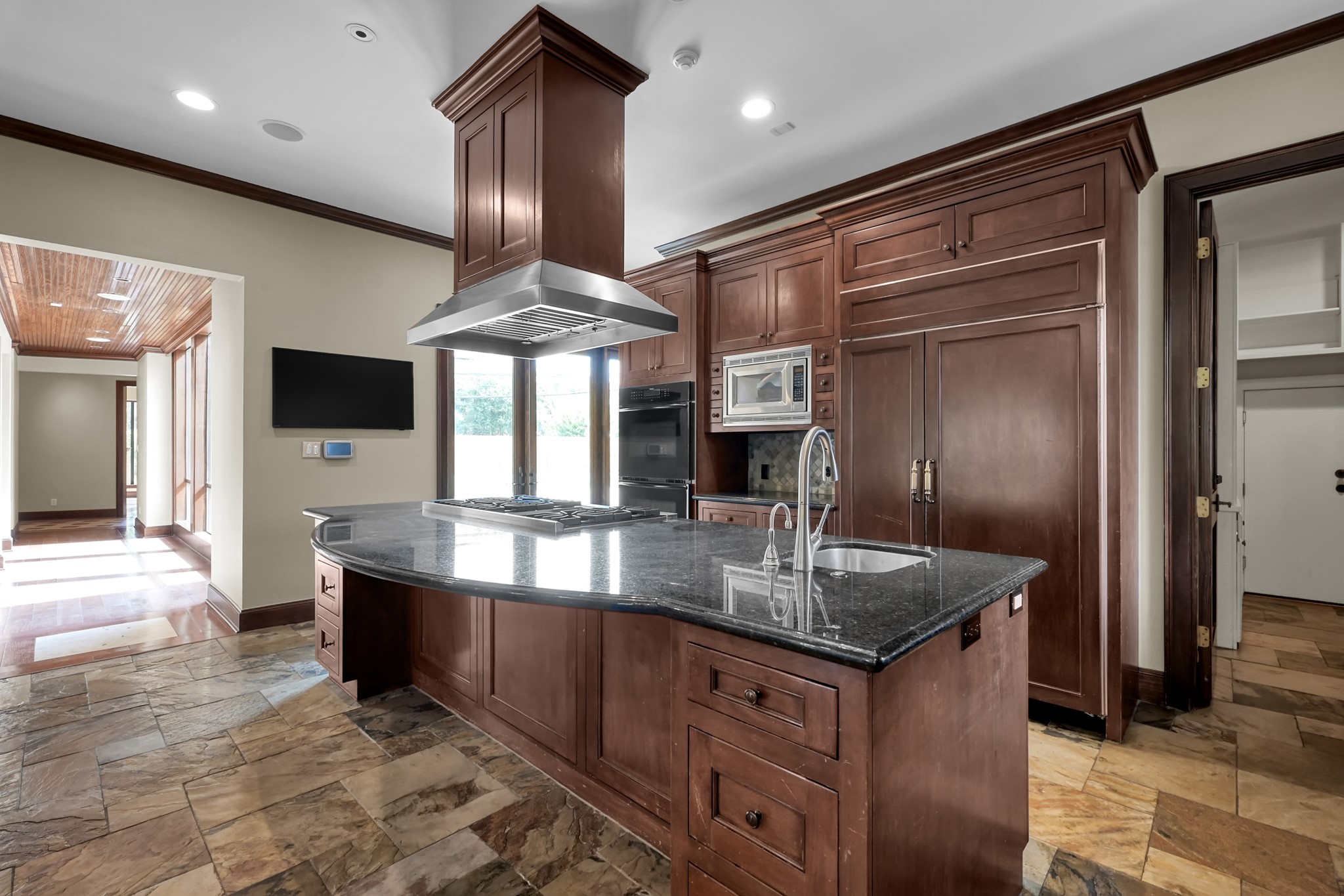 9602 Chatfield Street Houston, TX 77025 - Photo 10 of 48 a kitchen with stainless steel appliances granite countertop a sink refrigerator and cabinets