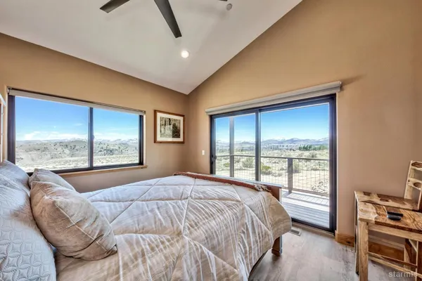a bedroom with a large bed and a window