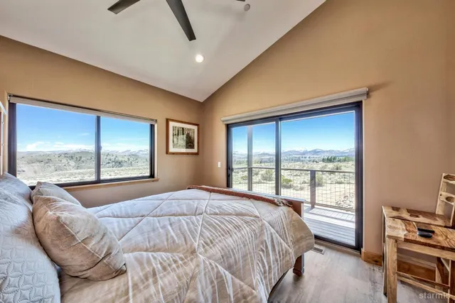 a bedroom with a large bed and a window