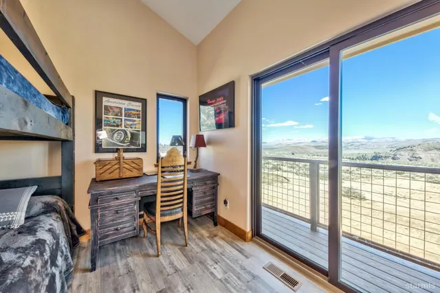 a bedroom with furniture and a window