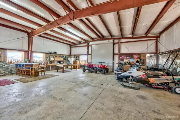 a view of parking garage with cars