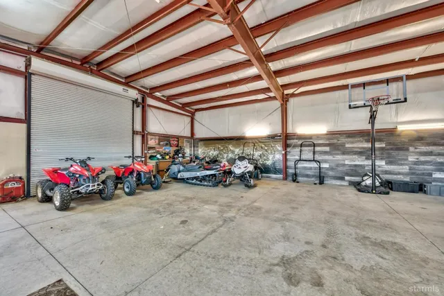a view of a garage with parked cars
