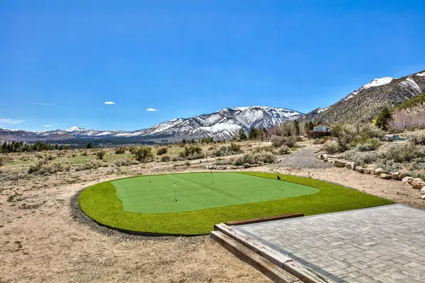 a view of a swimming pool with a yard