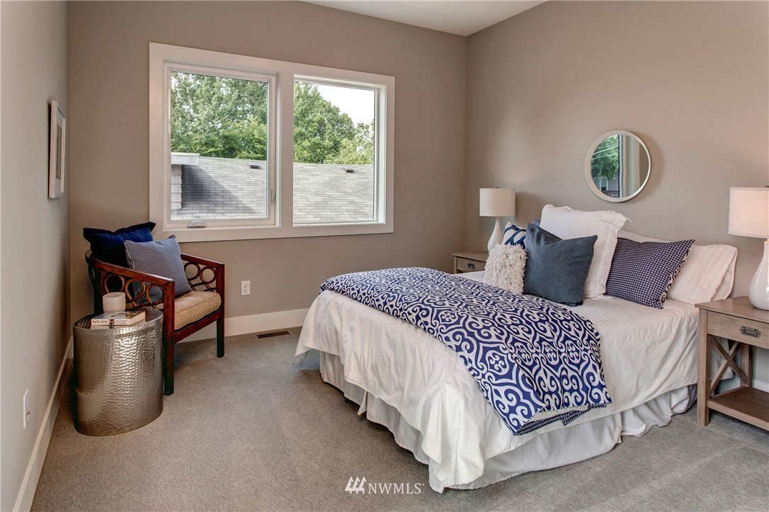 1002 North 30th Street Renton, WA 98056 - Photo 21 of 25 a bedroom with a bed and a window