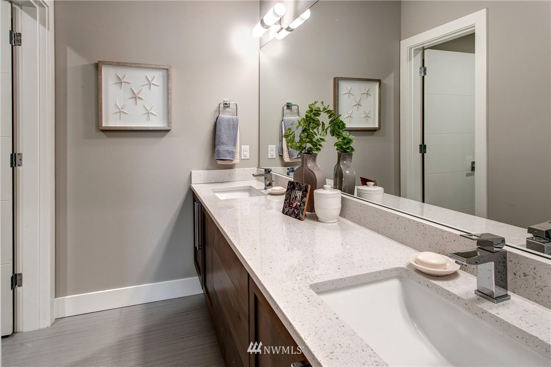 1002 North 30th Street Renton, WA 98056 - Photo 22 of 25 a room with a sink and a mirror